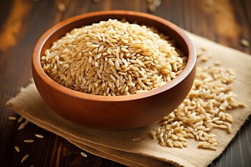 A wooden bowl filled with brown rice