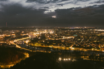Fototapeta na wymiar Scenic aerial view of Vilnius Old Town and Neris river at nightfall. Night view of Vilnius, Lithuania.