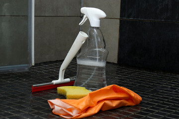 Bathroom cleaning equipment with shower wiper, spray bottle, gloves and a sponge