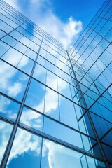 Blue glass skyscraper reflecting the sky