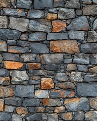 Fototapeta premium A brick wall made of various rocks and stones