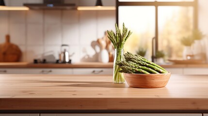 Fresh green asparagus on wooden table with blurred kitchen background, copy space for text