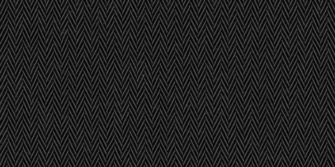 Seamless dark black and grey herringbone tweed textile texture background. Closeup of realistic tileable mottled distressed woolen striped zigzag fabric pattern. High resolution 3D rendering backdrop. - obrazy, fototapety, plakaty