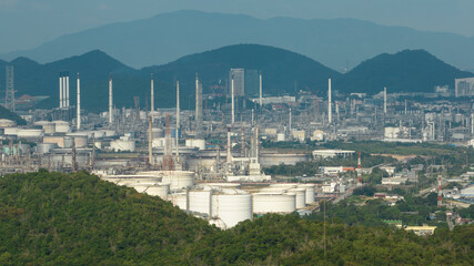 Obraz premium Oil refinery plant industry factory zone, oil and gas petrochemical industrial, oil storage tank and pipeline steel aerial view