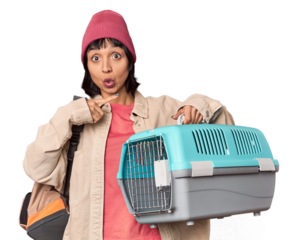 Young Hispanic woman ready for travel with pet carrier having some great idea, concept of creativity.