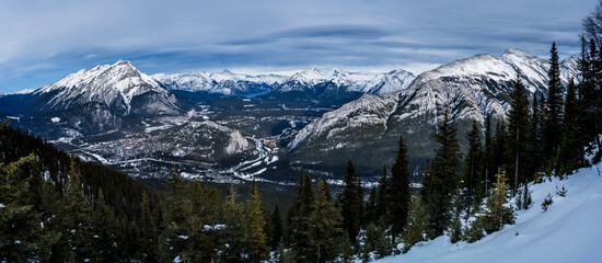 Panoramic shot on top of Mountains in Winter 