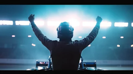 Photo sur Plexiglas F1 Silhouette of race car driver celebrating the win in a race against bright stadium lights. 100 FPS slow motion shot.track