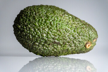 Green avocado on the table