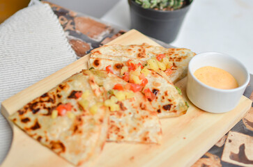 Enjoy the taste of a quesadilla filled with delicious vegetable sauce