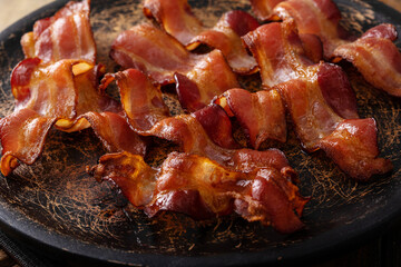 Crispy bacon on a plate cooked and ready to eat