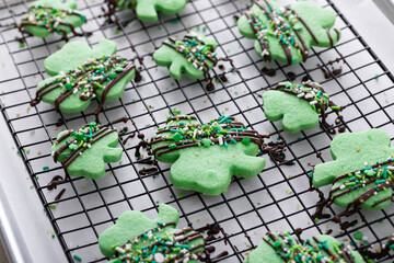 Shamrock cookies for Saint Patricks day with chocolate glaze and sprinkles