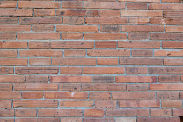 Close-up horizontal view retro red brown old brick wall background