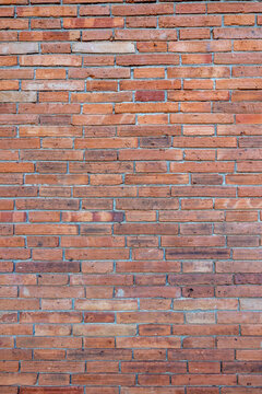 Vertical red brick wall texture grunge background for interior design