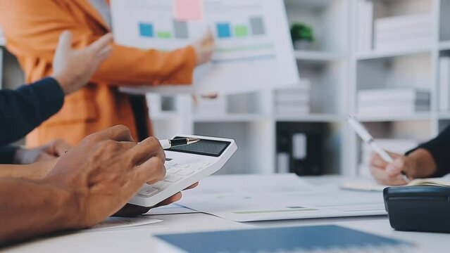 Close-up asia business people meeting plan analysis statistics brainstorm and header of team hold tablet pointing graph chart and employee take note. Finance strategy statistics success concept.