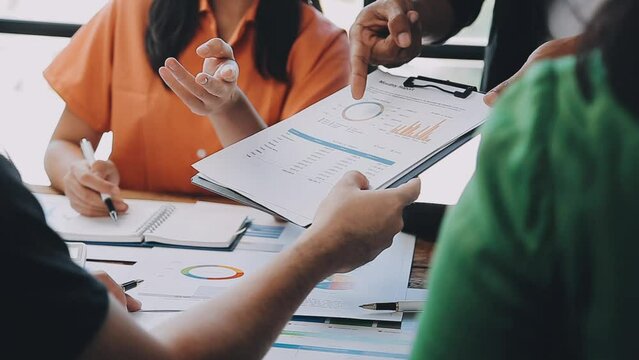 Close-up asia business people meeting plan analysis statistics brainstorm and header of team hold tablet pointing graph chart and employee take note. Finance strategy statistics success concept.