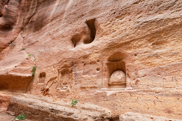 Pagan Nabataean altars carved into wall of Al Siq gorge in Nabatean Kingdom of Petra in the Wadi Musa city in Jordan