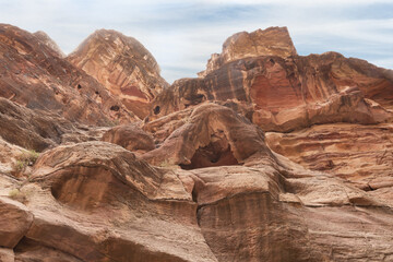 The beauty of high mountains at the beginning of the gorge Al Siq in Nabatean kingdom of Petra in Wadi Musa city in Jordan