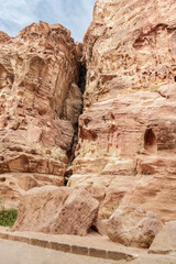 The beauty  of high mountains at beginning of the gorge Al Siq in Nabatean kingdom of Petra in Wadi Musa city in Jordan