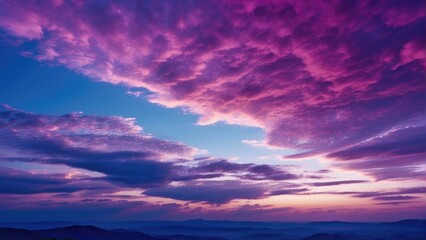 Naklejka na ściany i meble A Captivating Sky Photo Capturing Night Colors During Twilight. As Day Transforms into Night, Experience the Harmonious Blend of Deep Blue, Violet, and Pink Hues.