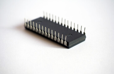 28-legged integrated circuit isolated on a white. Semiconductor electronic component.