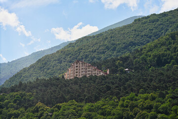 Fototapeta na wymiar Main building of the Armkhi ski resort in the mountain forest