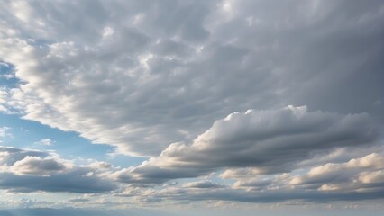 Obraz premium A Captivating Sky Photo Immersed in Cloudy or Overcast Colors. Witness the Subtle Beauty of Gray and White Tones as Clouds Paint the Sky, Creating a Diffuse, Muted Light.