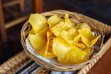 Cassava chips snack on wooden table