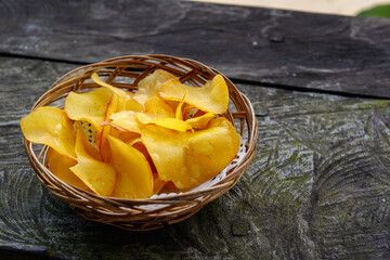 Cassava chips snack on wooden table