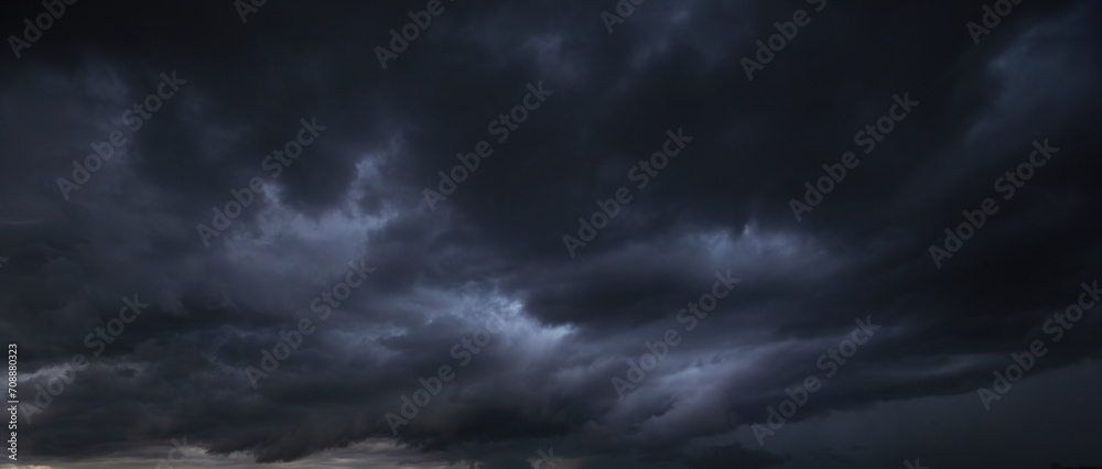Aufkleber The dark sky with heavy clouds converging and a violent storm before the rain.Bad or moody weather sky and environment. carbon dioxide emissions, greenhouse effect, global warming, climate change.