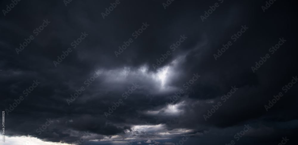 Poster the dark sky with heavy clouds converging and a violent storm before the rain.bad or moody weather s