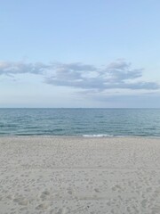 Fototapeta na wymiar Sunset at the beach, a calm blue see
