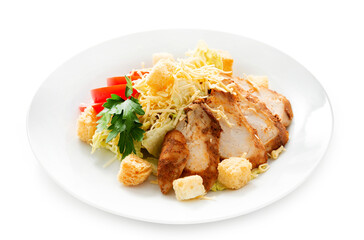 Caesar salad. Salad with chicken breast, tomato, vegetables, cheese. Isolated.