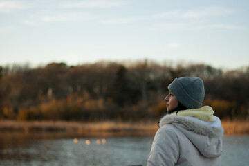Girl taking a breathe next to the lake