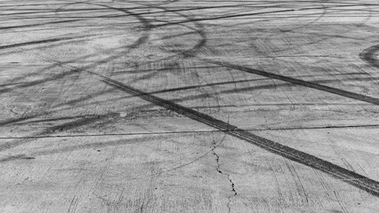 Tire track mark on asphalt tarmac road race track texture and background, Abstract background black...