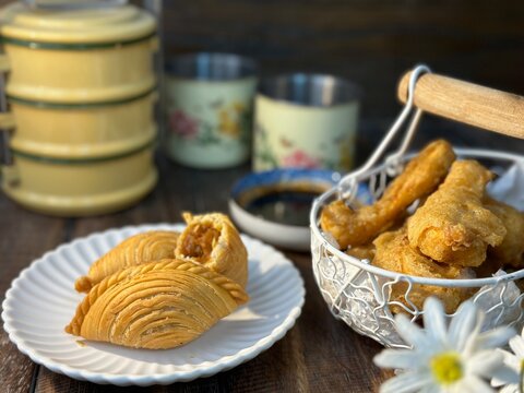 Curry Puffs Epok-Epok or Karipap Pusing - Deep Fried Malaysian, Singaporean, and Thai snack filled with curried meat and or vegetables.