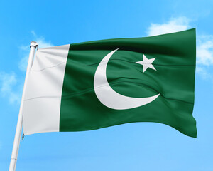 Pakistan flag fluttering in the wind on sky.