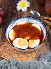 Delicious spicy indonesian Boiled egg with red pepper sauce called Sambal telur balado popular in Indonesia