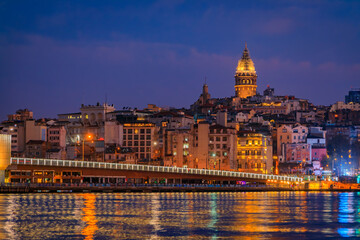 Fototapeta na wymiar Sunrise cityscape of the Karakoy area across the Bosphorus Strait near Galata Bridge with the Galata Tower at the blue hour in Istanbul, Turkey