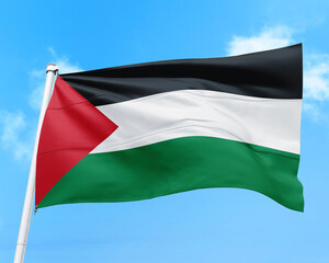 Palestine flag fluttering in the wind on sky.