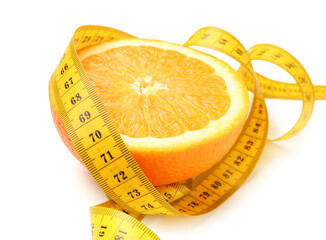 Cut orange and yellow measuring tape on white background. Diet concept