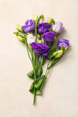 Bouquet of beautiful eustoma flowers on light background