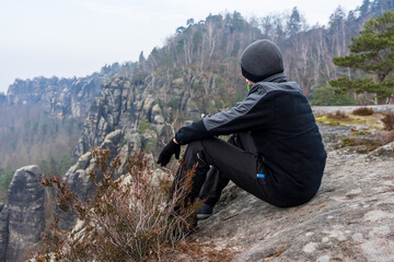 Teenager against the background of mountains. Schrammsteine - group of rocks are a long,...