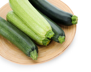 Plate with fresh green zucchini on white background