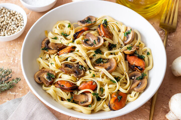 Tagliatelle pasta with mussels and mushrooms. Italian cuisine. Seafood.