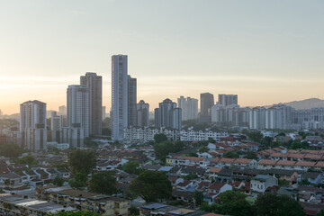 Naklejka premium condos towering over terrace houses