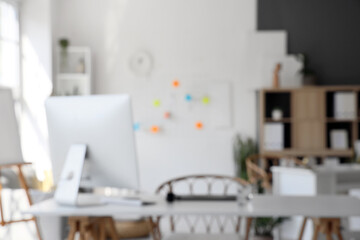 Blurred view of modern office with workplace