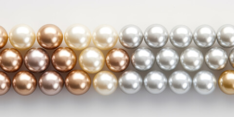beautiful shining mother of pearl pearls in a row on a white background
