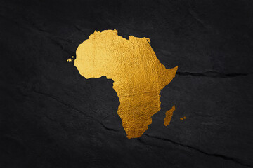 Africa continent shaped from golden glitter on a black background.