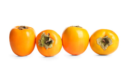 Many sweet ripe persimmons on white background