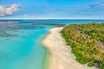 Fototapeta na wymiar Amazing island beach. Maldives tourism from aerial view tranquil tropical landscape seaside. Stunning palm trees white sandy beach. Exotic nature coast, luxury resort island. Beautiful summer holiday